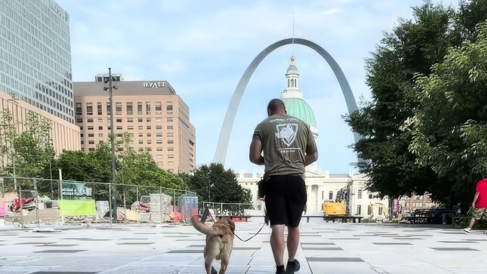 Aaron walking Maddie toward the Gateway Arch on her first trip to downtown St. Louis